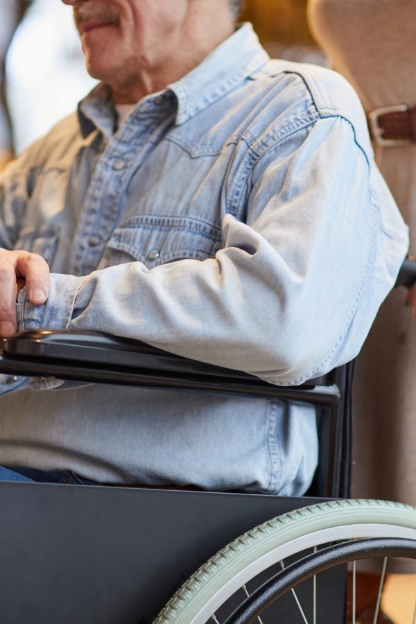 Volunteer working with handicapped man